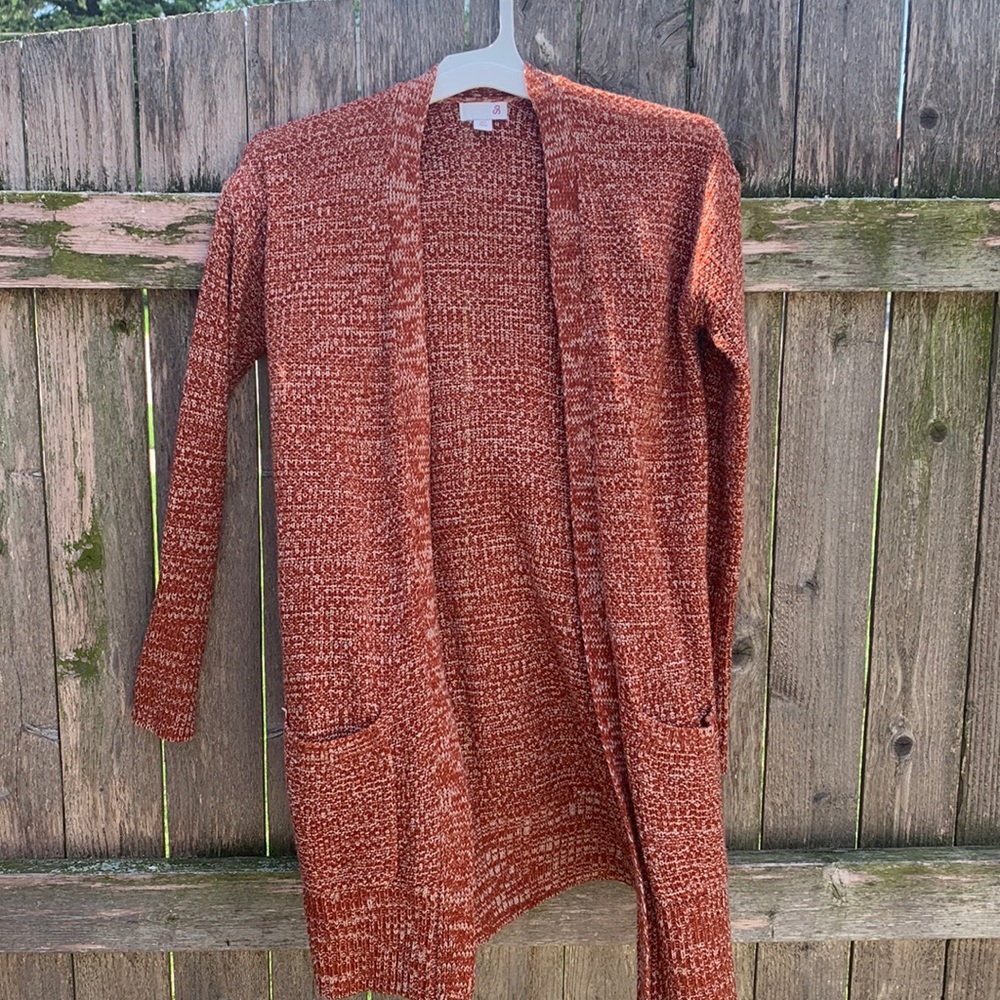 XS red and white cardigan from So with two front pockets